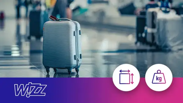 Szary walizka, gotowa na podróż. Sprawdź wymiary i wagę bagażu rejestrowanego Wizzair.